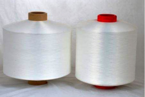 Deformed two-component polyester/nylon composit...